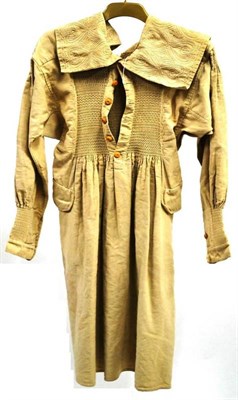 Lot 1144 - 19th Century Farmers Smock in heavy linen, with two side pockets, smocked and embroidered detailing