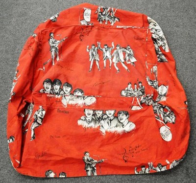 Lot 1185 - Beatles Red Ground Printed Cloth depicting the band in various group poses with signatures,...