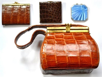 Lot 1187 - Circa 1940's Brown Crocodile Handbag of pouch shape with brass fittings and hinged fixed cover,...