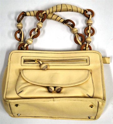 Lot 1197 - Anya Hindmarch Queenie Cream Leather Handbag with wooden ring and twisted leather ball handles,...