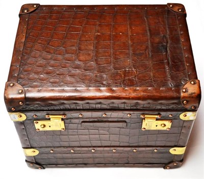 Lot 1201 - Small Brown Leather Trunk marked to the brass locks Finnigans Manchester, it has been restored with