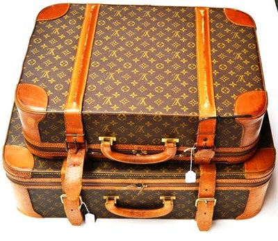 Lot 1206 - Two Graduated Louis Vuitton Monogrammed Leather Suitcases, both with leather trims and mounts,...