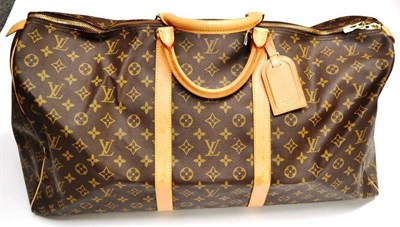 Lot 1208 - Louis Vuitton Canvas Logo Printed Keepall 60 Holdall, with tan leather straps and handles and...