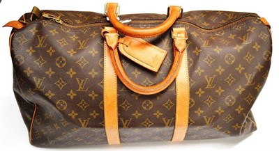 Lot 1209 - Louis Vuitton Canvas Logo Printed Keepall 50 Holdall, with tan leather straps and handles and...