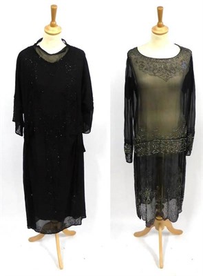 Lot 2160 - Circa 1920's Black Chiffon Long Sleeved Drop Waist Dress with silver bead decoration and...