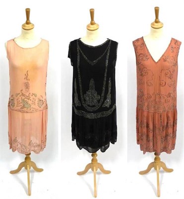 Lot 2162 - Two Circa 1920's Pink Chiffon and Crepe Drop Waist Shift Dresses with silver and white beadwork...