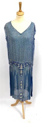 Lot 2166 - Circa 1920's Blue Chiffon Beaded Drop Waist Shift Dress appliqued with silver beads in...