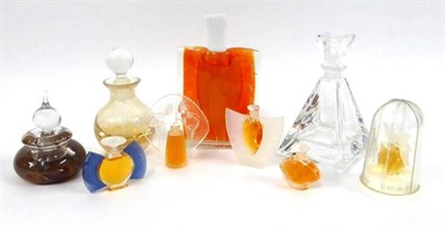 Lot 2230 - Four Miniature Lalique Scent Bottles, Nina Ricci L'Air Du Temps miniature scent bottle under...