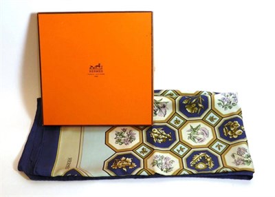 Lot 2244 - A Hermes Silk Scarf of floral design within a navy blue border, in a Hermes card box, 90cm by 90cm