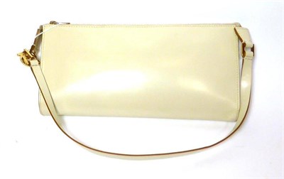 Lot 2255 - Salvatore Ferragamo Ivory Leather Shoulder Bag with brass mounts, zip to the top, logo fabric...