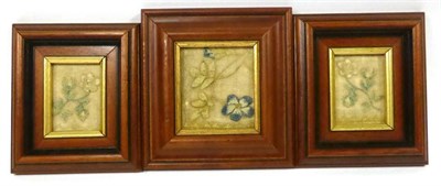 Lot 2277 - Three Early 19th Century Embroidered Fragments depicting flowers, in modern frames, 15cm x 18cm and