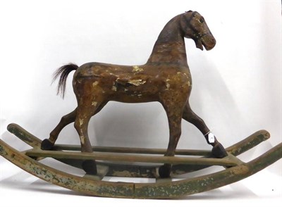 Lot 4 - Early 19th Century Carved Rocking Horse with brown leather ears, painted brown with painted...