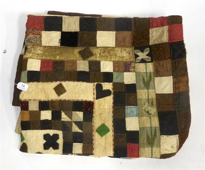 Lot 14 - 19th Century Patchwork 'Wedding' Quilt worked in coloured silks and brocades within a brown and...