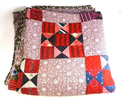 Lot 17 - Late 19th Century Patchwork Quilt of geometric design in coloured cottons on a mauve floral...