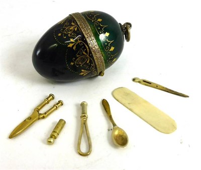 Lot 27 - Continental Miniature Silver Gilt Necessaire of oval from with a hinged cover, decorated with green