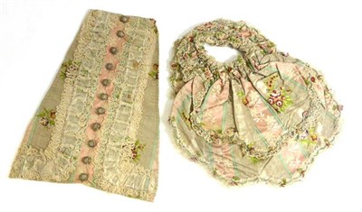 Lot 79 - 18th Century Stomacher in cream and woven floral silk stripes, silk embroidered buttons,...