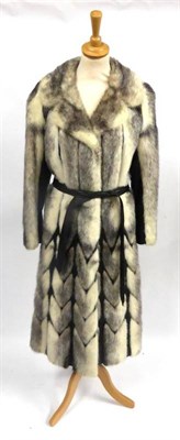 Lot 100 - Kohinoor Mink And Black Leather Trimmed Coat of chevron design with leather belt tie, size 10/12