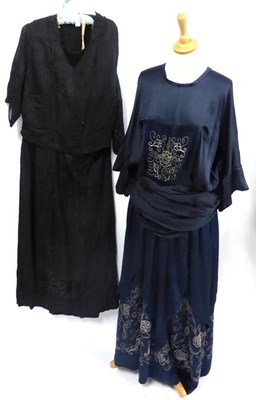 Lot 117 - Circa 1920's Black Silk Drop Waist Dress with hand embroidered panels to the bodice and skirt,...