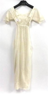 Lot 140 - Circa 1805/10 White Cotton Muslin Dress, embroidered with 'sprigs' of flowers, 'bib' style...