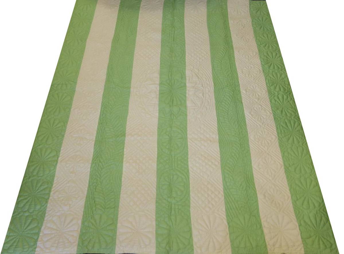 Lot 1028 - Early 20th Century Green and Cream Striped Quilt, with a cream reverse, 190cm by 230cm