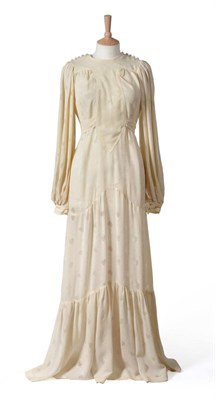 Lot 2072 - Early 1970's Ossie Clark Cream Crepe Full Length Wedding Dress with round collar, buttons to...