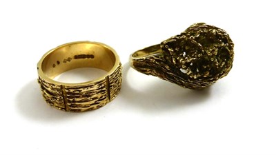 Lot 2148 - Two 9ct Gold Rings, the first of textured asymmetric swirl form, finger size O, the second a...