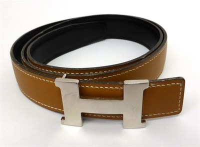 Lot 2177 - Hermes Light Tan/Black Reversible Leather Belt with chrome 'H' buckle, with impressed marks...