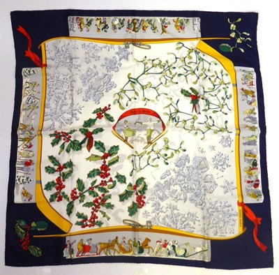 Lot 2188 - Hermes Silk Scarf 'Neige d'Antan', depicting skiers amongst mistletoe and holly within a navy...