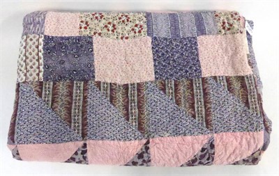 Lot 2025 - Late 19th Century Mosaic Quilt in purple and pink cottons with white reverse, 200cm by 210cm