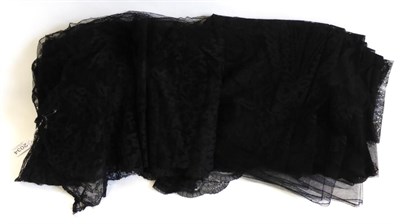 Lot 2034 - 19th Century Black Lace Flounce of floral design with scalloped hem, 900cm by 54cm; and Another...