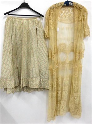 Lot 2111 - Late 19th Century Cream Lace Robe with lace inserts, short sleeves, decorative embroidered hem;...