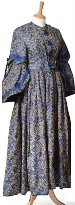 Lot 2118 - 19th Century Blue and Silvered Brocade Dress with long tiered sleeves, flared cuffs, ribbon and...