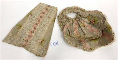 Lot 2147 - 18th Century Stomacher in cream and woven floral silk stripes, silk embroidered buttons,...