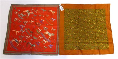 Lot 2155 - Hermes Silk Pocket Scarf 'Raconte-Moi Le Cheval' on a red ground with pewter border, 42cm...