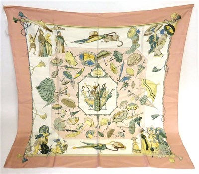 Lot 2171 - Hermes Silk Scarf 'Ombrelles et Parapluie's' designed by H de Watrigant on a pale pink ground, 90cm