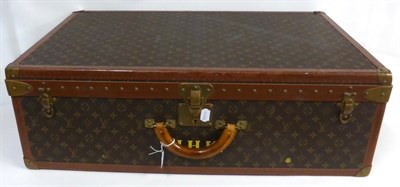 Lot 2180 - Louis Vuitton Alzer Suitcase in LV monogram canvas, hand painted with initials 'H.H.K' to the...