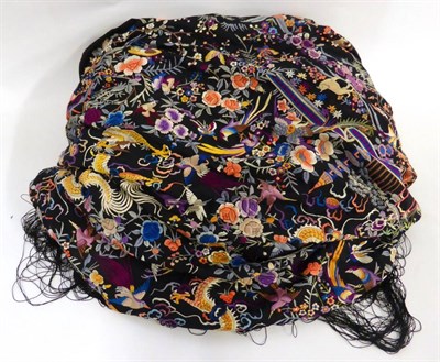 Lot 2188 - Chinese Black Silk Shawl embroidered in coloured silks all over with animals and flowers, 190cm...