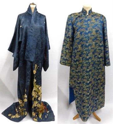 Lot 2196 - Early 20th Century Japanese Blue Figured Silk Kimono printed to the rolled hem with a warriors...