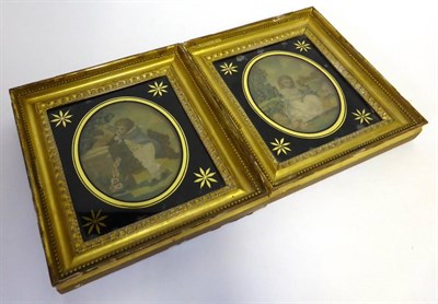 Lot 2200 - A Pair of Late 18th Century Silk Work Pictures of oval form depicting young children picking...