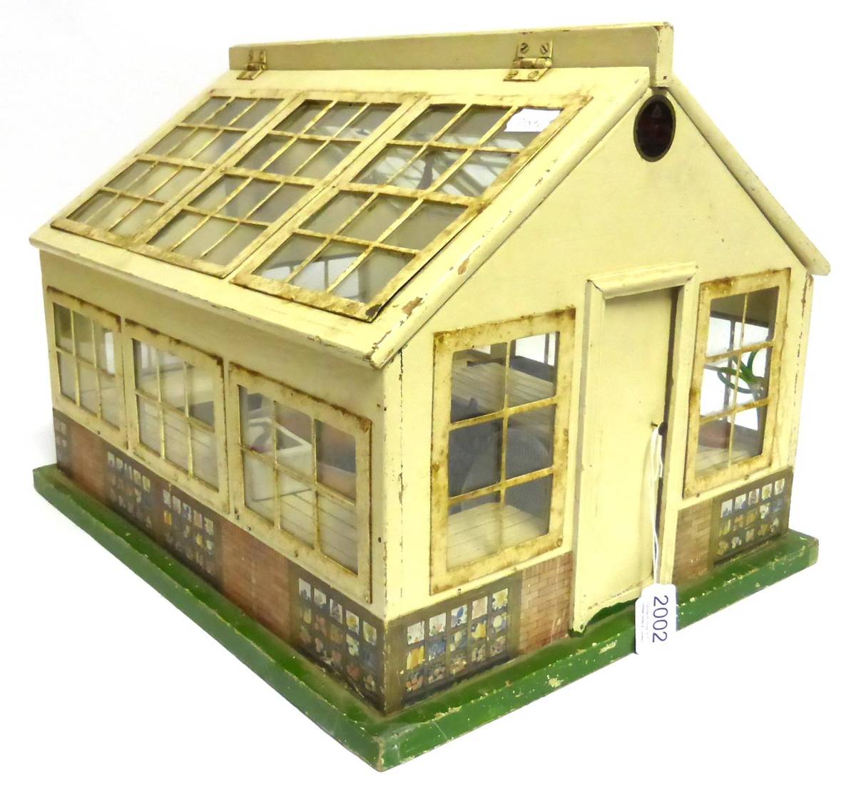 Lot 2002 - Circa 1920/30's Lines Brothers Pedigree Prams Dolls Greenhouse, with a cream painted wooden...