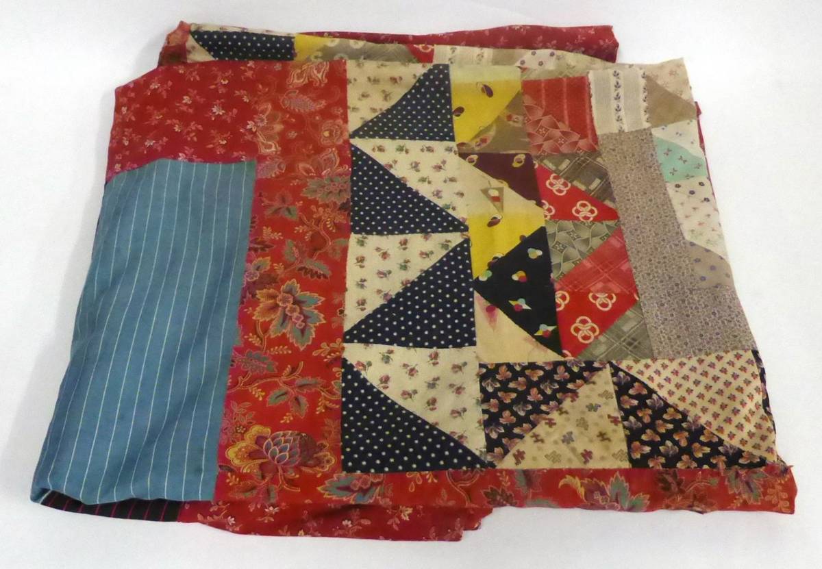 Lot 2027 - Late 19th Century Patchwork Cover, with central design of triangles surrounded by frames of...