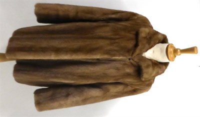 Lot 2098 - Light Brown Mink Jacket with shaped hem; Mitzi Lorenz Mink Hat with brown suede lace detailing;...