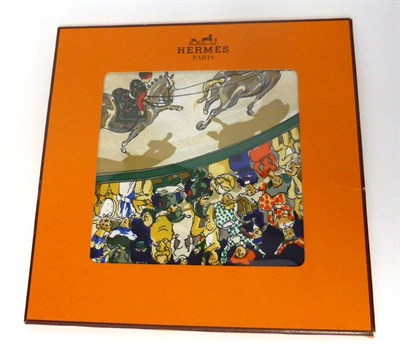 Lot 2159 - Hermes Silk Scarf Cirque Mollier designed by Philippe Dumas, on a navy blue ground, in original...