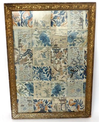Lot 2197 - Chinese Patchwork, comprising embroidered silk panels from sleeve bands and panels, in a large gilt