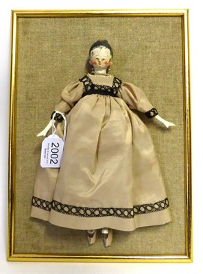 Lot 2002 - Early 19th Century German Wooden Tuck Comb Doll, with carved features and painted hair and face, in