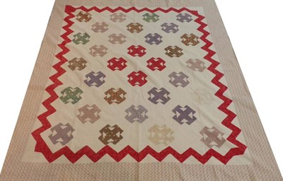 Lot 2023 - Early 20th Century Patchwork Quilt, with floral sprigged border, red printed cotton zig zag...