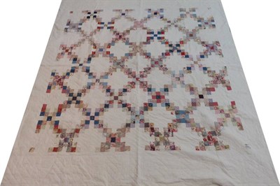 Lot 2025 - Early 20th Century White Quilt, with printed cotton square patchworks, 220cm by 250cm