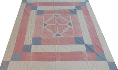 Lot 2032 - Late 19th Century Irish Linen Wedding Patchwork Cover, worked in pink and blue printed cottons,...