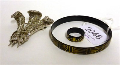 Lot 2046 - A Bangle and A Ring Set, by Michaela Frey, the black body with gold coloured pattern, ring size...