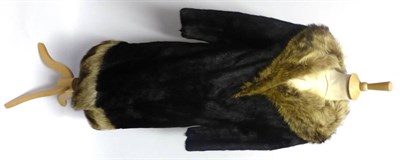 Lot 2065 - Black Mink Coat with Silver Fox Trim, to the collar and hem